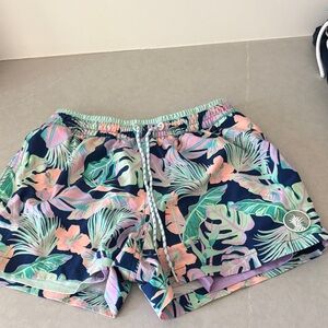 chubbies Navy Swim Trunks with Mint Green & Soft Pink Tropical Print